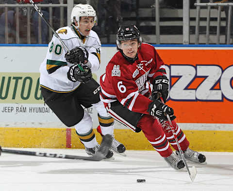 LONDON, ON – NOVEMBER 12: Ryan Merkley #6 of the Guelph Storm skates away from a checking Alex Formenton #80 of the London Knights during an OHL game at Budweiser Gardens on November 12, 2016 in London, Ontario, Canada. The Knights defeated the Storm 4-1. (Photo by Claus Andersen/Getty Images)