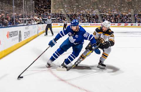 TORONTO, ON – NOVEMBER 15: John Tavares #91 of the Toronto Maple Leafs skates against Matt Grzelcyk #48 of the Boston Bruins during the third period at the Scotiabank Arena on November 15, 2019 in Toronto, Ontario, Canada. (Photo by Mark Blinch/NHLI via Getty Images)