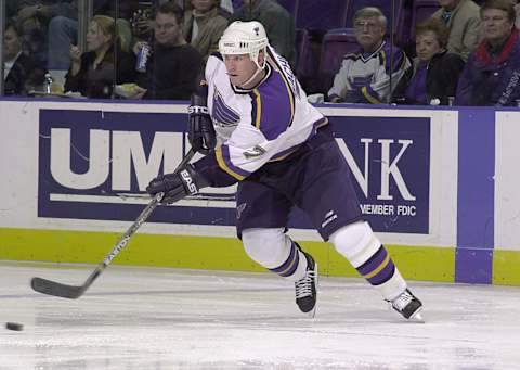 22 Mar 2001: Keith Tkachuk #7 of the St. Louis Blues clears the puck against the Colorado Avalanche during the first period at the Savvis Center in St. Louis, Missouri. DIGITAL IMAGE. Mandatory Credit: Elsa/ALLSPORT