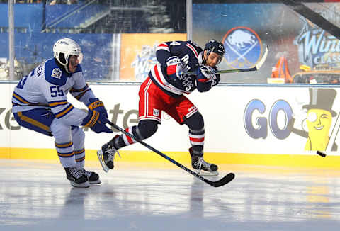 NEW YORK, NY – JANUARY 1: Boo Nieves #24 of the New York Rangers shoots the puck against Rasmus Ristolainen #55 of the Buffalo Sabres during the 2018 Bridgestone NHL Winter Classic at Citi Field on January 1, 2018 in New York, New York. (Photo by Bill Wippert/NHLI via Getty Images)