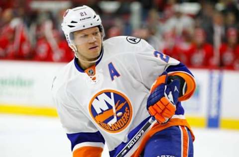 Feb 13, 2016; Raleigh, NC, USA; New York Islanders forward Kyle Okposo (21) skates against the Carolina Hurricanes at PNC Arena. The Carolina Hurricanes defeated the New York Islanders 6-3. Mandatory Credit: James Guillory-USA TODAY Sports