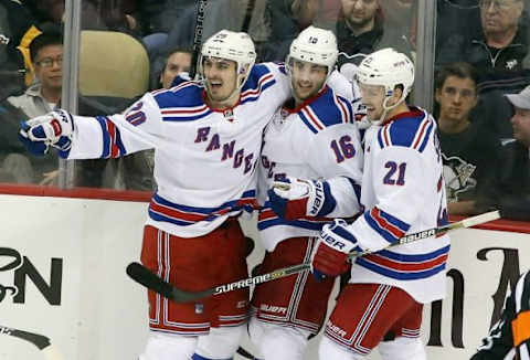 Apr 20, 2015; Pittsburgh, PA, USA; New York Rangers left wing Chris Kreider (20) celebrates scoring a goal with center Derick Brassard (16) and center Derek Stepan (21) against the Pittsburgh Penguins during the second period in game three of the first round of the 2015 Stanley Cup Playoffs at the CONSOL Energy Center. Mandatory Credit: Charles LeClaire-USA TODAY Sports