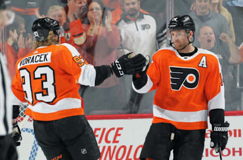 PHILADELPHIA, PA – APRIL 06: Sean Couturier #14 of the Philadelphia Flyers celebrates his second period power-play goal against the Carolina Hurricanes with Jakub Voracek #93 on April 6, 2019 at the Wells Fargo Center in Philadelphia, Pennsylvania. (Photo by Len Redkoles/NHLI via Getty Images)