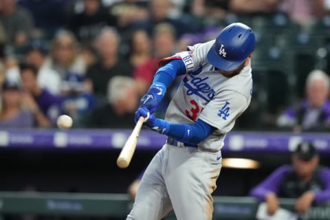 Jul 28, 2022; Denver, Colorado, USA; Los Angeles Dodgers center fielder Cody Bellinger (35) hits a two run double in the fourth inning against the Colorado Rockies at Coors Field. Mandatory Credit: Ron Chenoy-USA TODAY Sports