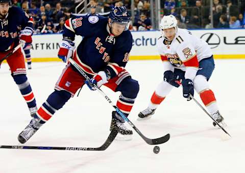 Mar 17, 2017; New York, NY, USA; New York Rangers left wing J.T. Miller (10) controls the puck against Florida Panthers left wing Jonathan Huberdeau (11) during first period at Madison Square Garden. Mandatory Credit: Noah K. Murray-USA TODAY Sports