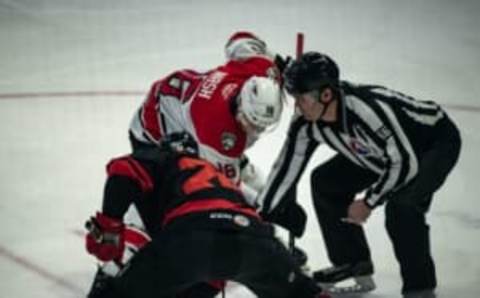 Utica’s Ryan Schmelzer and Charlotte’s Riley Nash battle during a face-off at the Adirondack Bank Center in Utica on Wednesday, January 25, 2023. Charlotte went on to defeat Utica by a score of 4-0.Schmelzer Nash Utica Comets Vs Charlotte Checkers