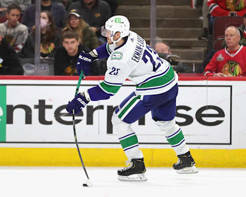 CHICAGO, ILLINOIS – OCTOBER 21: Oliver Ekman-Larsson #23 of the Vancouver Canucks passes against the Chicago Blackhawksat the United Center on October 21, 2021 in Chicago, Illinois. The Canucks defeated the Blackhawks 4-1. (Photo by Jonathan Daniel/Getty Images)