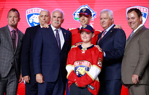 VANCOUVER, BRITISH COLUMBIA – JUNE 21: Spencer Knight, 12th overall pick by the Florida Panthers, poses for a group photo onstage with team personnel during the first round of the 2019 NHL Draft at Rogers Arena on June 21, 2019 in Vancouver, Canada. (Photo by Jeff Vinnick/NHLI via Getty Images)