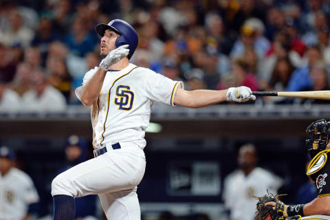 Apr 19, 2016; San Diego, CA, USA; San Diego Padres third baseman Adam Rosales (9) hits a solo home run during the fifth inning against the Pittsburgh Pirates at Petco Park. Mandatory Credit: Jake Roth-USA TODAY Sports. MLB.