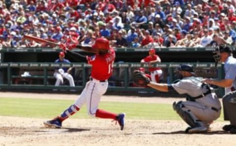 Jun 5, 2016; Arlington, TX, USA; Texas Rangers designated hitter Jurickson Profar (19) drives in a run in the fifth inning against the Seattle Mariners at Globe Life Park in Arlington. Mandatory Credit: Tim Heitman-USA TODAY Sports