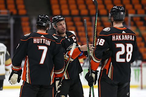 Ryan Getzlaf #15 talks with Ben Hutton #7 and Jani Hakanpaa #28 of the Anaheim Ducks (Photo by Sean M. Haffey/Getty Images)