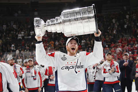 LAS VEGAS, NV – JUNE 07: John Carlson #74 of the Washington Capitals carries the Stanley Cup in celebration after his team defeated the Vegas Golden Knights 4-3 in Game Five of the 2018 NHL Stanley Cup Final at the T-Mobile Arena on June 7, 2018 in Las Vegas, Nevada. (Photo by Bruce Bennett/Getty Images)