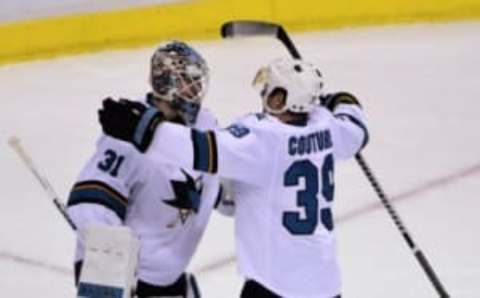 Mar 3, 2016; Vancouver, British Columbia, CAN; San Jose Sharks forward Logan Couture (39) congratulates San Jose Sharks goaltender Martin Jones (31) for the win after the third period at Rogers Arena. The San Jose Sharks won 3-2. Mandatory Credit: Anne-Marie Sorvin-USA TODAY Sports