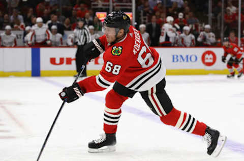 CHICAGO, ILLINOIS – SEPTEMBER 25: Slater Koekkoek #68 of the Chicago Blackhawks passes the puck against the Washington Capitalsduring a preseason game at the United Center on September 25, 2019, in Chicago, Illinois. The Capitals defeated the Blackhawks 6-0. (Photo by Jonathan Daniel/Getty Images)