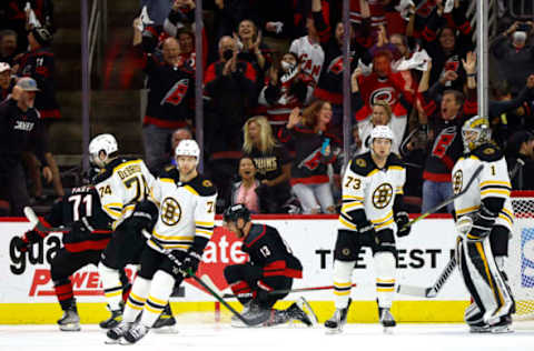 RALEIGH, NORTH CAROLINA – MAY 14: Max Domi #13 of the Carolina Hurricanes celebrates following his second-period goal in Game Seven of the First Round of the 2022 Stanley Cup Playoffs against the Boston Bruins at PNC Arena on May 14, 2022, in Raleigh, North Carolina. (Photo by Jared C. Tilton/Getty Images)