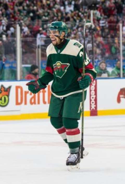 Feb 21, 2016; Minneapolis, MN, USA; Minnesota Wild defenseman Matt Dumba (24) celebrates following a Stadium Series hockey game against the Chicago Blackhawks at TCF Bank Stadium. The Wild defeated the Blackhawks 6-1. Mandatory Credit: Brace Hemmelgarn-USA TODAY Sports