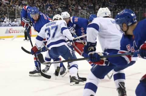 NEW YORK, NY – FEBRUARY 02: Kevin Hayes #13 of the New York Rangers battles for the puck against Yanni Gourde #37 of the Tampa Bay Lightning at Madison Square Garden on February 2, 2019 in New York City. (Photo by Jared Silber/NHLI via Getty Images)