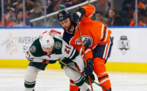 Oilers’ Zach Kassian losing a battle for the puck.  Credit: Perry Nelson-USA TODAY Sports