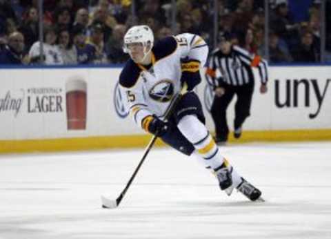 Jan 22, 2016; Buffalo, NY, USA; Buffalo Sabres center Jack Eichel (15) carries the puck up the ice during the second period against the Detroit Red Wings at First Niagara Center. Mandatory Credit: Timothy T. Ludwig-USA TODAY Sports