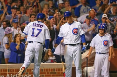 Jun 18, 2016; Chicago, IL, USA; Chicago Cubs left fielder Kris Bryant (17) is congratulated for hitting a home run by first baseman 