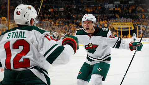 NASHVILLE, TN – MARCH 27: Mikael Granlund #64 celebrates with Eric Staal #12 of the Minnesota Wild after a goal against the Nashville Predators during an NHL game at Bridgestone Arena on March 27, 2018 in Nashville, Tennessee. (Photo by John Russell/NHLI via Getty Images)