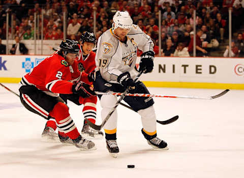 CHICAGO – APRIL 24: Jason Arnott #19 of the Nashville Predators controls the puck under pressure from Duncan Keith #2 and Marian Hossa #81 of the Chicago Blackhawks in Game Five of the Western Conference Quarterfinals during the 2010 NHL Stanley Cup Playoffs at the United Center on April 24, 2010 in Chicago, Illinois. The Blackhawks defeated the Predators 5-4 in overtime. (Photo by Jonathan Daniel/Getty Images)