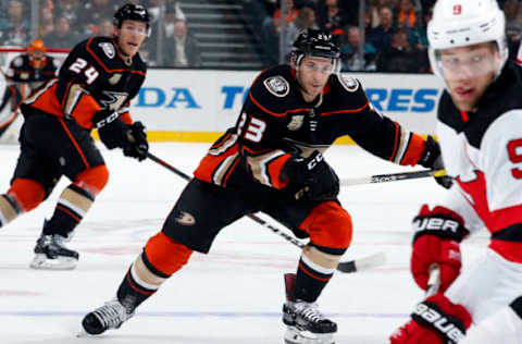 ANAHEIM, CA – DECEMBER 9: Brian Gibbons #23 and Carter Rowney #24 of the Anaheim Ducks skate against Taylor Hall #9 of the New Jersey Devils during the game against the New Jersey Devils on December 9, 2018, at Honda Center in Anaheim, California. (Photo by Debora Robinson/NHLI via Getty Images)