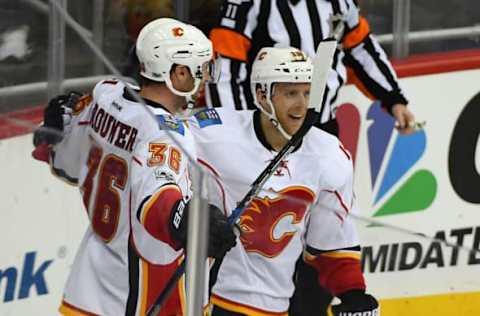 Mar 21, 2017; Washington, DC, USA; Calgary Flames right wing Troy Brouwer (36) is congratulated by teammates after scoring a goal against the Washington Capitals during the third period at Verizon Center. The Washington Capitals won 4-2. Mandatory Credit: Brad Mills-USA TODAY Sports