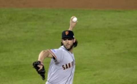 Oct 29, 2014; Kansas City, MO, USA; San Francisco Giants pitcher Madison Bumgarner throws a pitch against the Kansas City Royals in the fifth inning during game seven of the 2014 World Series at Kauffman Stadium. Mandatory Credit: Denny Medley-USA TODAY Sports