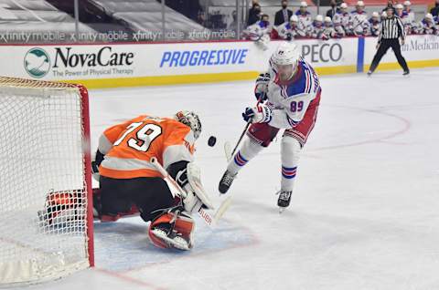 Philadelphia Flyers goaltender Carter Hart (79) makes a save against New York Rangers right wing Pavel Buchnevich (89) on a penalty shot dCredit: Eric Hartline-USA TODAY Sports