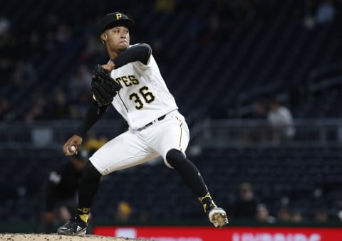 Apr 26, 2023; Pittsburgh, Pennsylvania, USA; Pittsburgh Pirates relief pitcher Dauri Moreta (36) pitches against the Los Angeles Dodgers during the ninth inning at PNC Park. The Pirates won 8-1. Mandatory Credit: Charles LeClaire-USA TODAY Sports