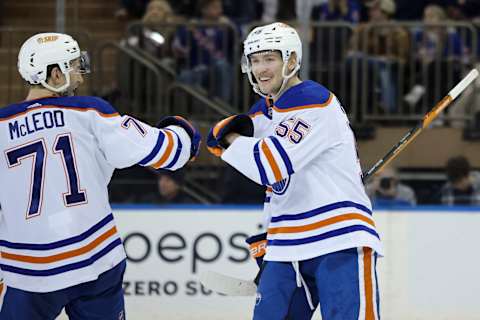 Nov 26, 2022; New York, New York, USA; Edmonton Oilers left wing Dylan Holloway (55) celebrates with Edmonton Oilers center Ryan McLeod (71) after Holloway’s goal against the Edmonton Oilers during the third period at Madison Square Garden. Mandatory Credit: Jessica Alcheh-USA TODAY Sports