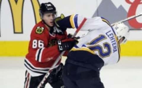 Apr 19, 2016; Chicago, IL, USA; Chicago Blackhawks left wing Teuvo Teravainen (86) and St. Louis Blues center Jori Lehtera (12) push each other during the second period in game four of the first round of the 2016 Stanley Cup Playoffs at United Center. Mandatory Credit: David Banks-USA TODAY Sports