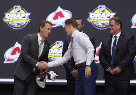 Jun 24, 2016; Buffalo, NY, USA; Tyson Jost shakes hands with Joe Sakic after being selected as the number ten overall draft pick by the Colorado Avalanche in the first round of the 2016 NHL Draft at the First Niagra Center. Mandatory Credit: Timothy T. Ludwig-USA TODAY Sports