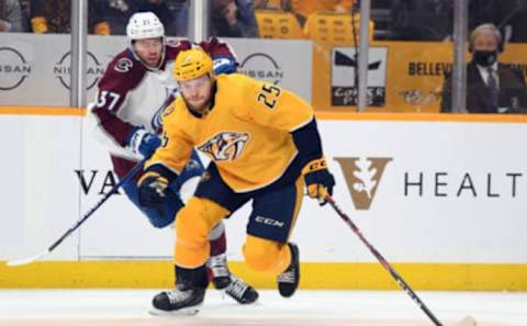 May 7, 2022; Nashville, Tennessee, USA; Nashville Predators right wing Mathieu Olivier (25) skates the puck into the offensive zone during the first period against the Colorado Avalanche in game three of the first round of the 2022 Stanley Cup Playoffs at Bridgestone Arena. Mandatory Credit: Christopher Hanewinckel-USA TODAY Sports