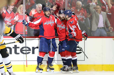 Washington Capitals left wing Alex Ovechkin (8) celebrates with teammates while rocking the red (Geoff Burke-USA TODAY Sports)