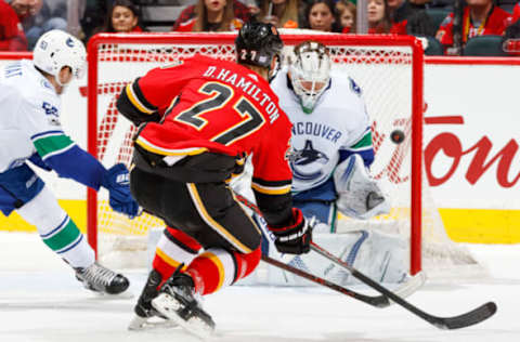 CALGARY, AB – NOVEMBER 7: Dougie Hamilton #27 of the Calgary Flames scores in an NHL game against the Vancouver Canucks at the Scotiabank Saddledome on November 7, 2017 in Calgary, Alberta, Canada. (Photo by Gerry Thomas/NHLI via Getty Images)