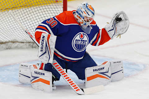 Nov 26, 2023; Edmonton, Alberta, CAN; Edmonton Oilers goaltender Calvin Pickard (30) makes a save during warmup against the Anaheim Ducks at Rogers Place. Mandatory Credit: Perry Nelson-USA TODAY Sports