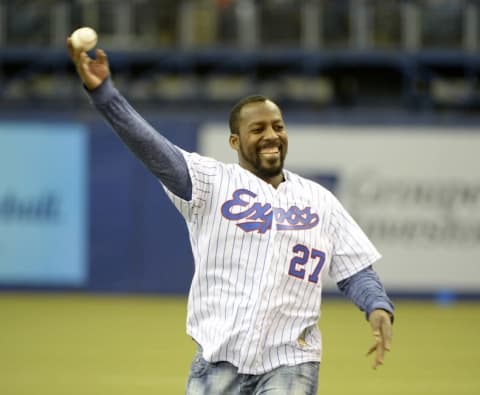 Apr 3, 2015; Montreal, Quebec, CAN; Former Montreal Expos Vladimir Guerrero throws the first pitch before the game between the Cincinnati Reds and the Toronto Blue Jays at the Olympic Stadium. Mandatory Credit: Eric Bolte-USA TODAY Sports