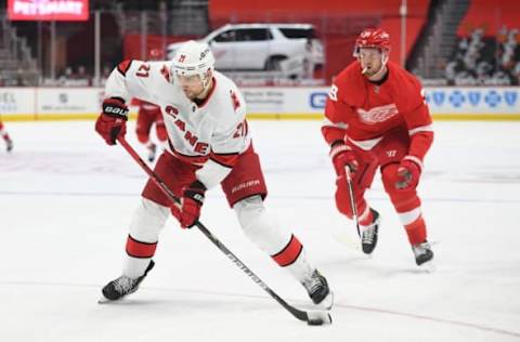 Mar 14, 2021; Detroit, Michigan, USA; Carolina Hurricanes right wing Nino Niederreiter (21) shoots during the third period against the Detroit Red Wings at Little Caesars Arena. Mandatory Credit: Tim Fuller-USA TODAY Sports