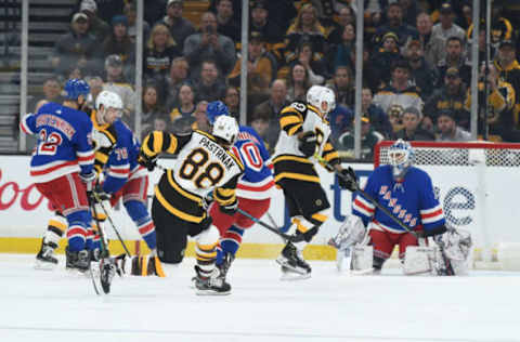 BOSTON, MA – MARCH 27: David Pastrnak #88 of the Boston Bruins shoots and scores against the New York Rangers at the TD Garden on March 27, 2019 in Boston, Massachusetts. (Photo by Steve Babineau/NHLI via Getty Images)