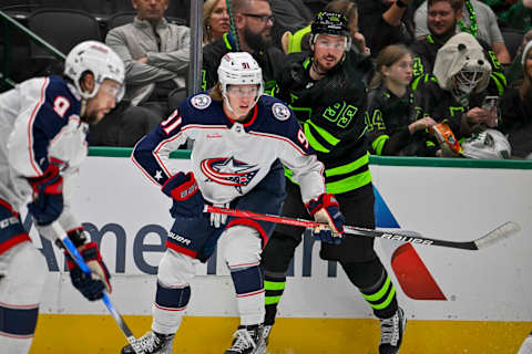 Oct 30, 2023; Dallas, Texas, USA; Columbus Blue Jackets center Kent Johnson (91) and Dallas Stars center Matt Duchene (95) chase the puck during the second period at the American Airlines Center. Mandatory Credit: Jerome Miron-USA TODAY Sports