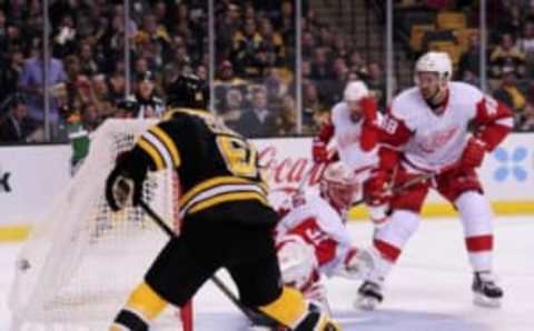 Sep 28, 2016; Boston, MA, USA; Boston Bruins center Austin Czarnik (61) scores a goal past Detroit Red Wings goalie Jared Coreau (31) in the second period during a preseason hockey game at TD Garden. Mandatory Credit: Bob DeChiara-USA TODAY Sports