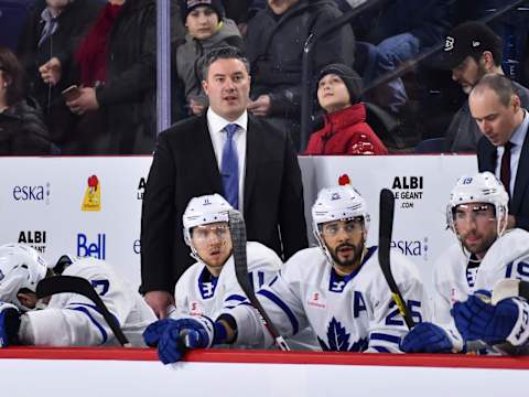 Toronto Maple Leafs – Coach Greg Moore looks on from behind the Toronto Marlies bench (Photo by Minas Panagiotakis/Getty Images)