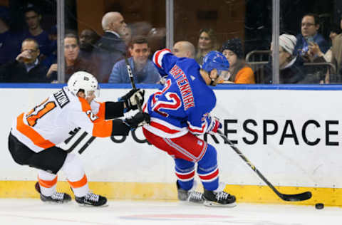 NEW YORK, NY – JANUARY 29: Philadelphia Flyers Left Wing Scott Laughton (21) checks New York Rangers Left Wing Chris Kreider (20) from behind during the National Hockey League game between the Philadelphia Flyers and the New York Rangers on January 29, 2019 at Madison Square Garden in New York, NY. (Photo by Joshua Sarner/Icon Sportswire via Getty Images)