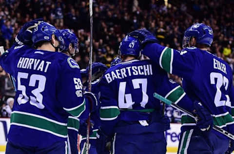 NHL Power Rankings: Vancouver Canucks defenseman Alexander Edler (23) celebrates a goal by forward Sven Baertschi (47) against Arizona Coyotes goaltender Mike Smith (not pictured) during the first period at Rogers Arena. Mandatory Credit: Anne-Marie Sorvin-USA TODAY Sports