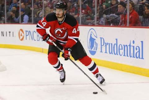 Jan 21, 2016; Newark, NJ, USA; New Jersey Devils defenseman Eric Gelinas (44) skates with the puck during the first period of their game against the Ottawa Senators at Prudential Center. Mandatory Credit: Ed Mulholland-USA TODAY Sports