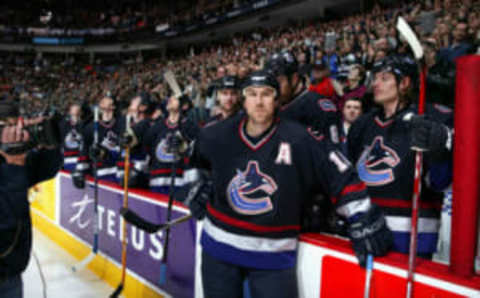 VANCOUVER – MARCH 13: Trevor Linden #16 of the Vancouver Canucks looks on near the bench during a break in game action against the Ottawa Senators at General Motors Place on March 13, 2004 in Vancouver, Canada. The Senators defeated the Canucks 2-1. (Photo by Jeff Vinnick/Getty Images)