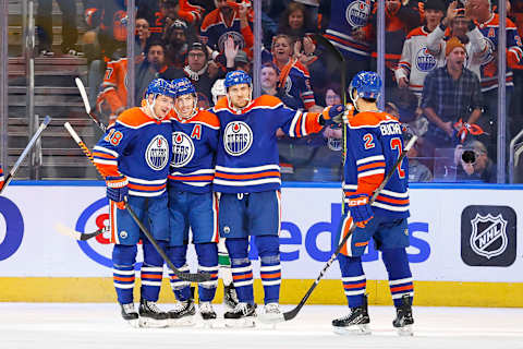 Oct 14, 2023; Edmonton, Alberta, CAN; The Edmonton Oilers celebrate a goal scored by forward Ryan Nugent-Hopkins (93) during the second period against the Vancouver Canucks at Rogers Place. Mandatory Credit: Perry Nelson-USA TODAY Sports