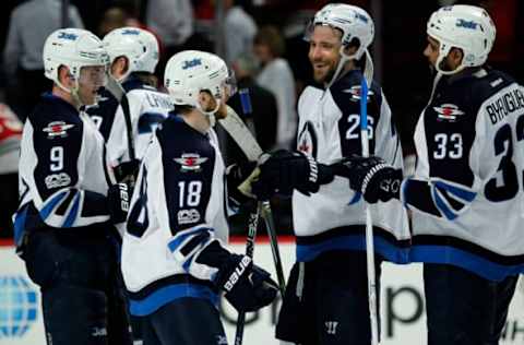 Vegas Golden Knights: Winnipeg Jets center Bryan Little (18), defenseman Dustin Byfuglien (33) and right wing Blake Wheeler (26) celebrate after defeating the Chicago Blackhawks at United Center. Mandatory Credit: Caylor Arnold-USA TODAY Sports